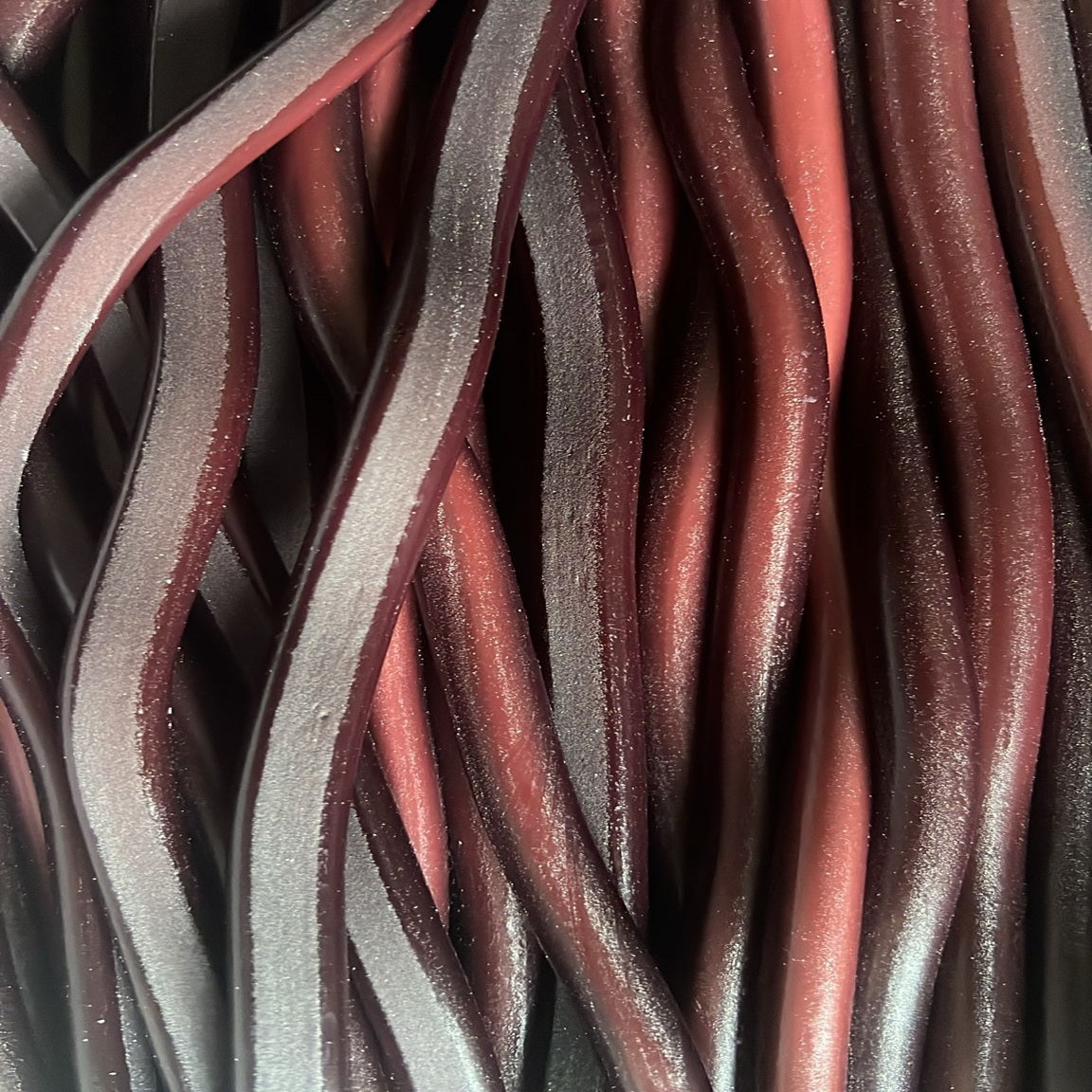 Réglisse américain acide CERISE lisse +/- 60cm